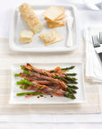 A simple 4 ingredients appetiser with asparagus wrapped in crispy prosciutto.